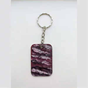 wood keychain with red abstract design