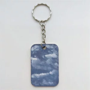 wood keychain with blue sky design