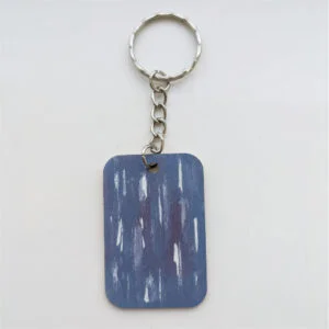 wood keychain with blue design