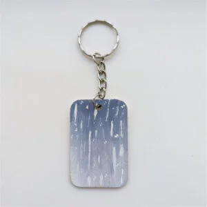 wood keychain with blue design