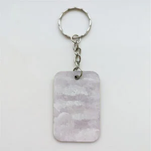 wood keychain with light purple sky design