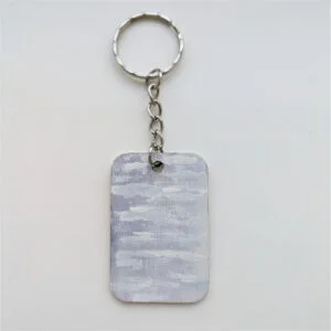 wood keychain with light purple sky design