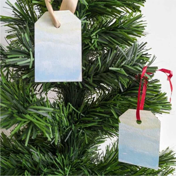 gift tags with Winter Mountains scene hanging as ornaments on tree