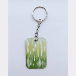 wood keychain with green abstract design
