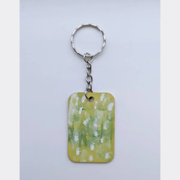 wood keychain with green abstract design