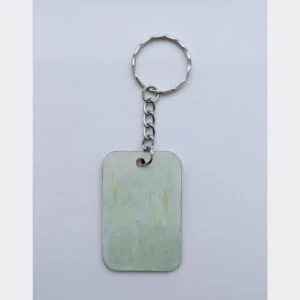 wood keychain with green abstract design