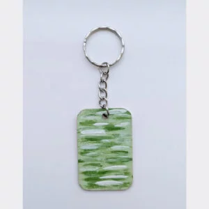 wood keychain with green abstract design