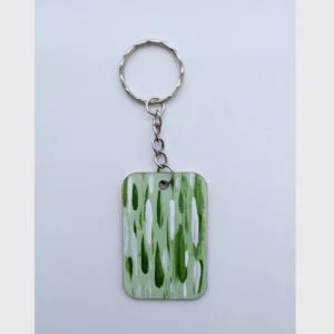 wood keychain with green abstract design