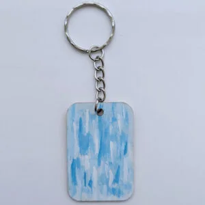 wood keychain with blue abstract design