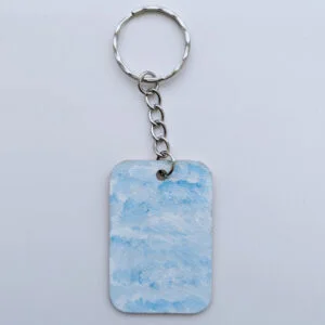 wood keychain with blue abstract design