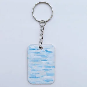 wood keychain with blue abstract design