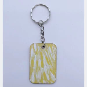 wood keychain with yellow abstract design