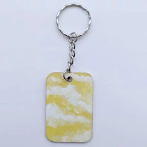 wood keychain with yellow abstract design