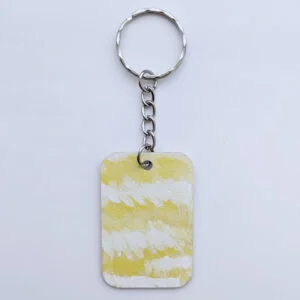 wood keychain with yellow abstract design