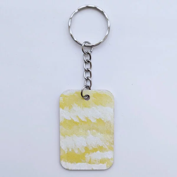 wood keychain with yellow abstract design