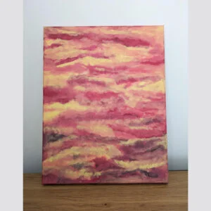 abstract painting with red, orange and yellow, placed on table