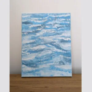 blue and white abstract painting placed on table